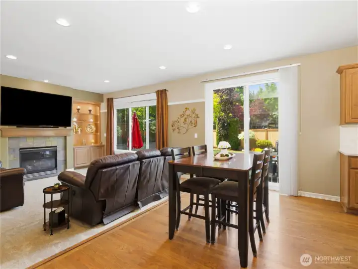 Bright breakfast nook overlooks the private backyard and seamlessly connects to the room and updated kitchen.