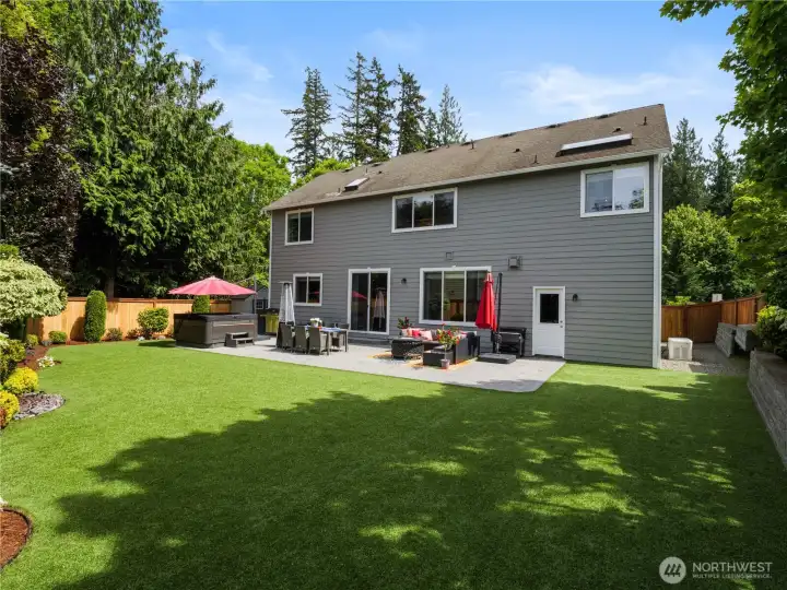 An outdoor oasis offering seamless indoor-outdoor living, perfect for summer barbecues, evening fires, and everyday relaxation.