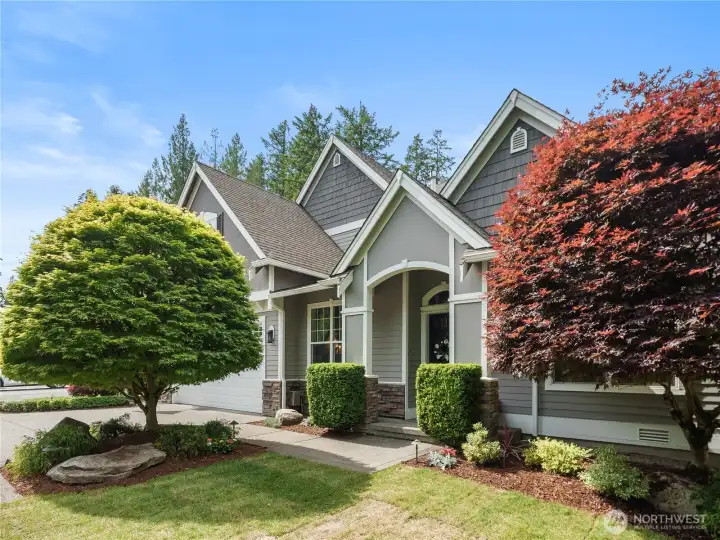 Welcome home to a stunning blend of Northwest architecture, mature landscaping, and inviting outdoor spaces.