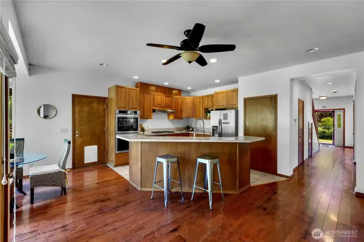 Kitchen has homework station and pantry