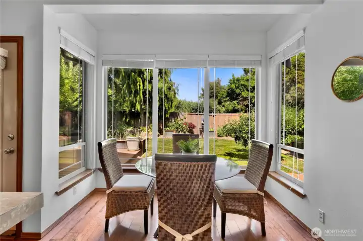 Sunny breakfast nook looks out on the gardens