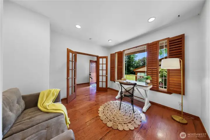 Main-floor office off entry w/ southern comfort shutters