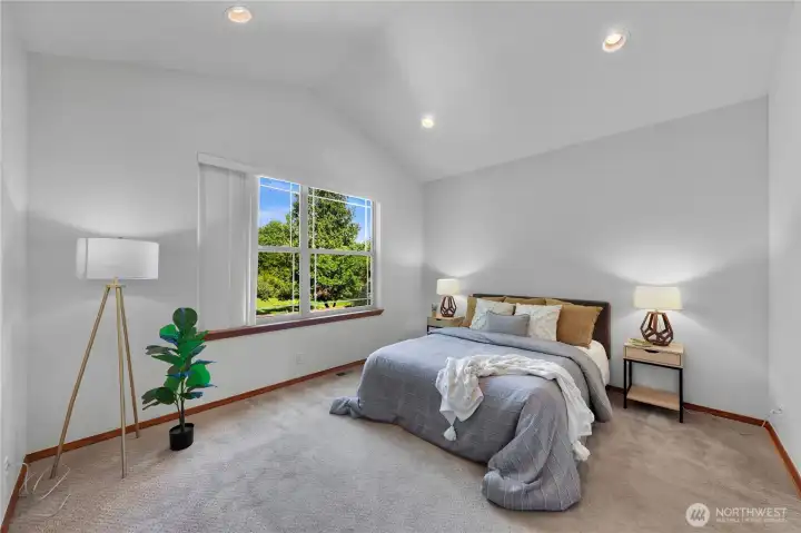 Private second-floor primary suite overlooks the grounds