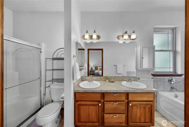 Primary bath is a refuge w/ walk-in shower, jetted tub and double sinks