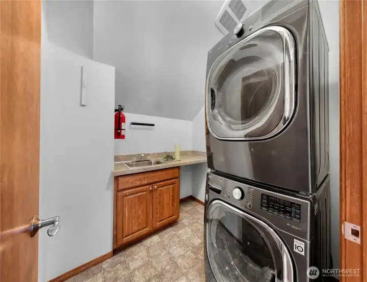 Second-floor laundry room w/ utility sink