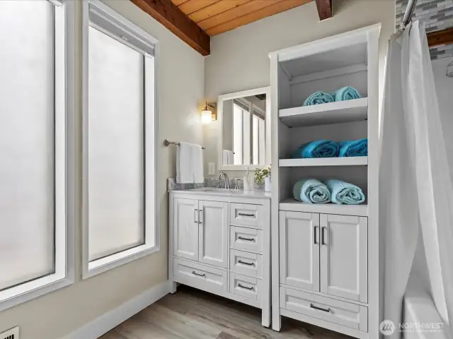 Here is a Peak into the Full Bathroom off of the Mudroom (East Entrance) on the Main Level.