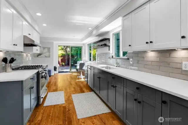 Recently updated kitchen with Alder wood window sills, Walnut floating shelves, Quartz countertops, tile backsplash, Deep basin sink, Pacific Trustream vent hood, Natural gas stove/oven, Disposal air switch, plus  Dog door to backyard!