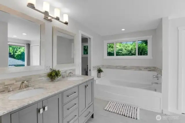 Newly added 5 piece Master Suite Bath with dual sinks, tile floors, enormous soaking tub!