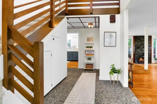 Vaulted Ceiling Entry with tons of storage under stairs including wine closet!