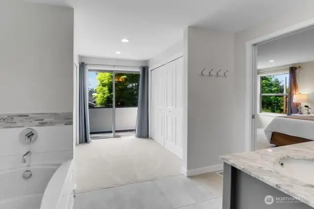Sitting area with two closets and a lovely little deck space to listen to birds and see sunsets, or just read and relax with coffee.