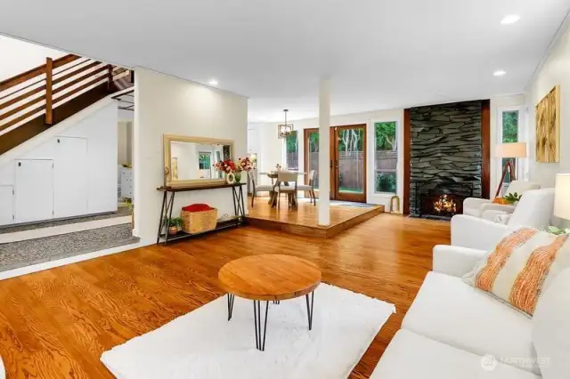 Brand new Oak Hardwood Floors with wood burning fireplace in this sprawling open spaced living area.  There is extra insulation between ceiling here and Master Bedroom above that makes this home live large so everyone sleeps in peacefully!