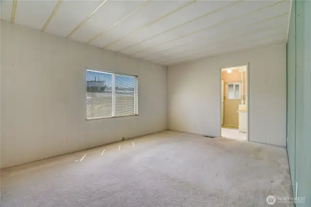 The spacious primary bedroom.