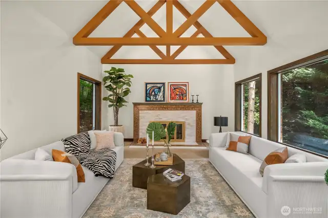 The living room centers around a beautifully framed fireplace, accented with fine woodwork and custom detailing