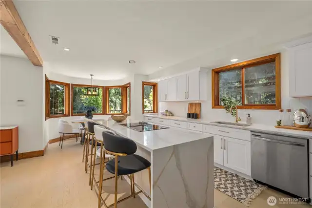 The newly updated kitchen is a showstopper—featuring sleek cabinetry, premium appliances, and a stunning waterfall island