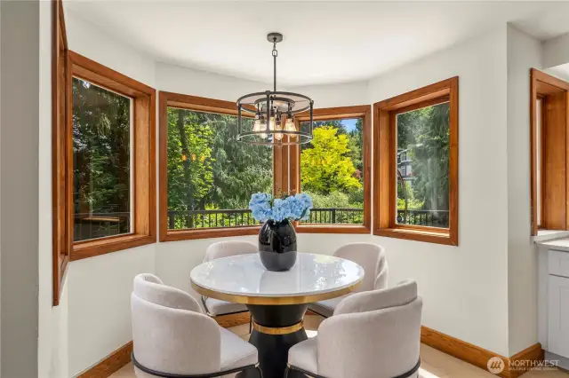 Cozy breakfast nook just off the kitchen, offering an intimate space for everyday dining and relaxed conversations.