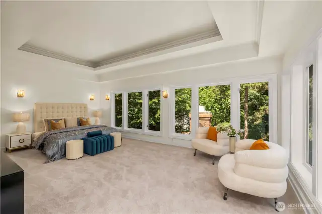Private master suite with oversized windows, offering abundant natural light and peaceful views.