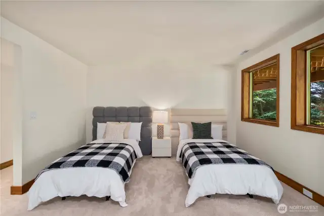 The lower level features a private, fully equipped living space—ideal for extended guests, multi-generational living, or potential rental income.