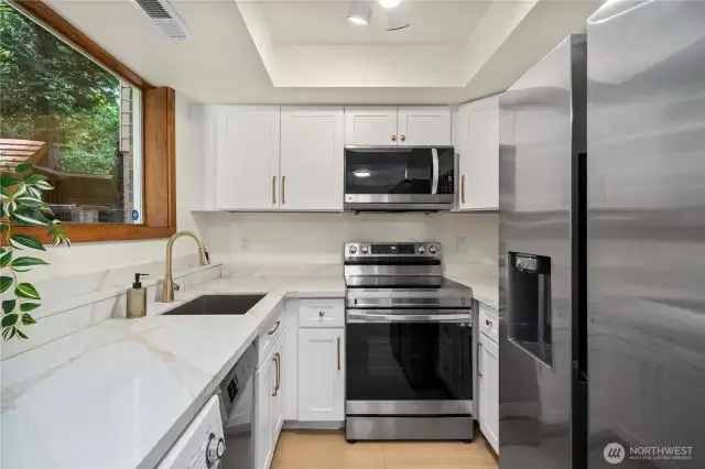 A full second kitchen on the lower level provides added convenience for multi-generational living, long-term guests, or potential rental use