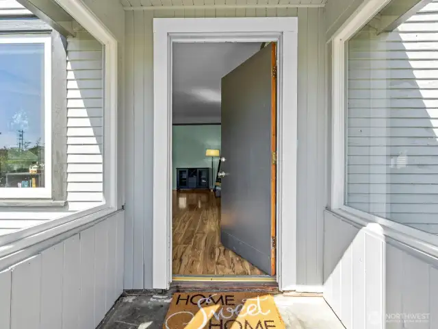 The darling covered entryway allows you a spot to remove your shoes before coming in.