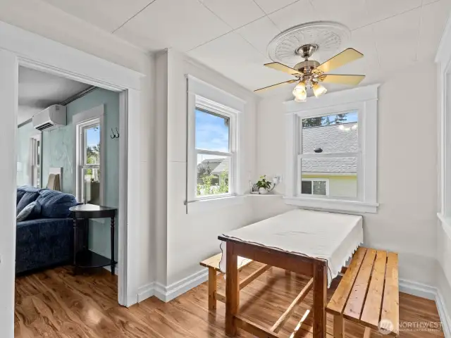 The dining nook with windows on all 3 sides is light, bright and airy. A nice sized table fits well here.