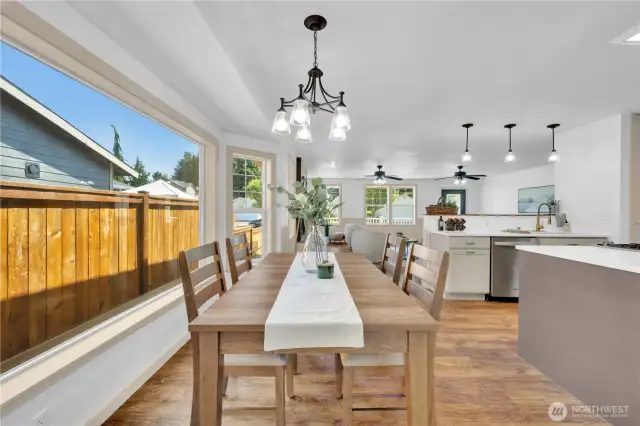 Extra large windows grace the kitchen eat in nook