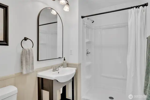 Primary bathroom with new black fixtures