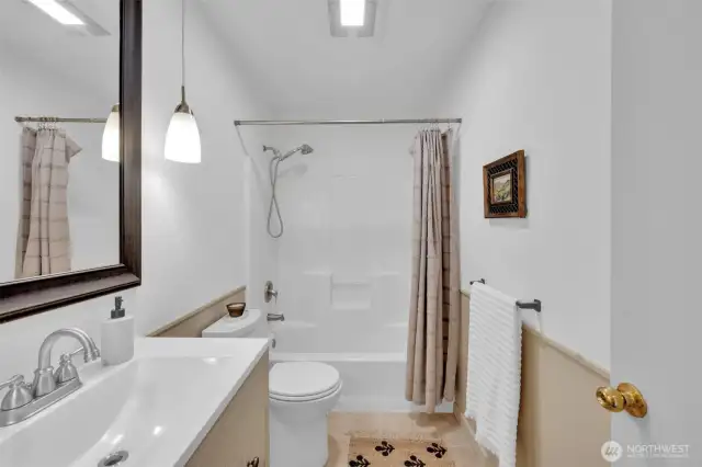 Hallway bathroom with tub