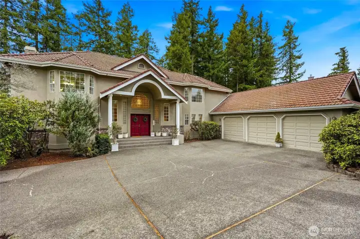 Beautiful NW Contemporary home in Lake Forest Estates featuring panoramic Lake Wilderness views, oversized .50-acre lot, 3-car garage, tile roof, and private cul-de-sac setting in Maple Valley WA.