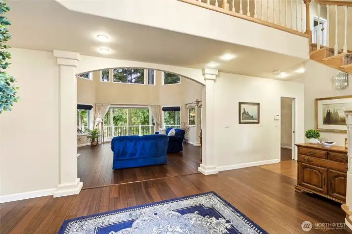Grand vaulted ceilings and bamboo flooring welcome you into this light-filled Maple Valley home, designed so nearly every room captures stunning Lake Wilderness views.