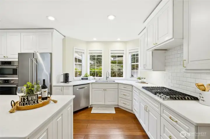 Spacious kitchen with modern finishes, ample counter space, and open-concept design flowing into dining and living areas—ideal for entertaining in Maple Valley WA.