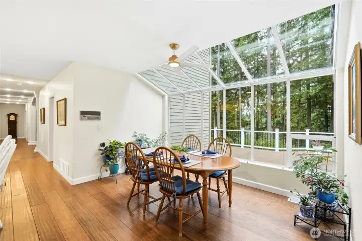 Dining area surrounded by windows capturing stunning Lake Wilderness and territorial views, offering everyday elegance in Maple Valley WA.