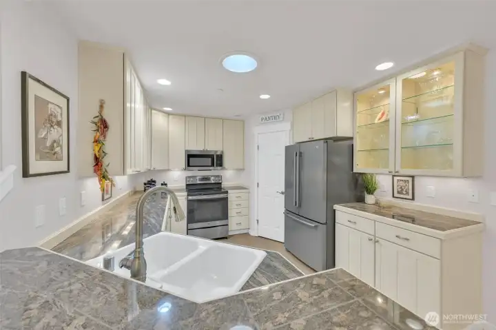 Kitchen with Eating Space at Bar Top and Large Pantry