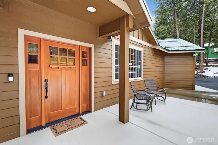 Heated concrete pad leading to the front door with Ring camera included.