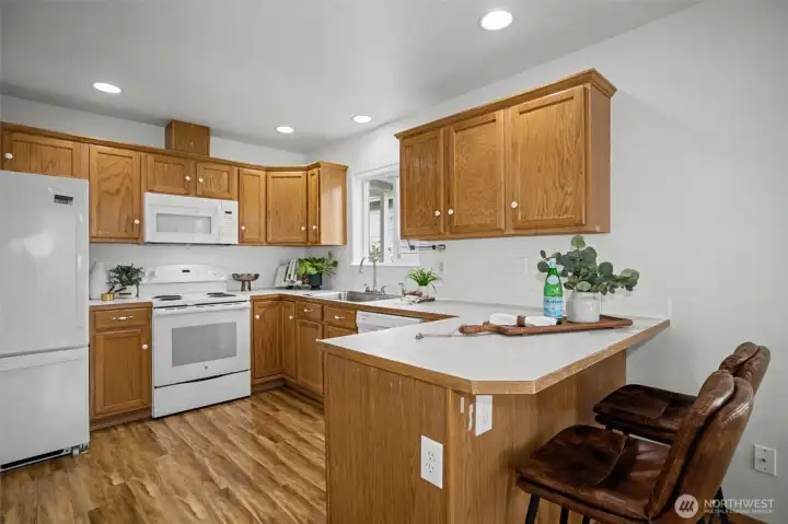 Kitchen featuring ample cabinetry and perfect breakfast bar.