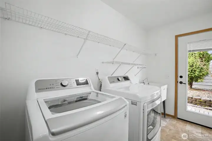 Laundry area with washer and dryer included on main level.