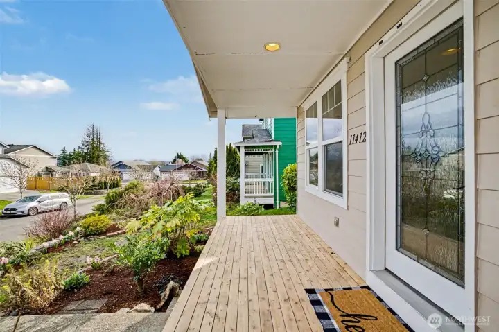 Covered patio overlooking landscaped yard...perfect for morning coffee or afternoon iced tea.