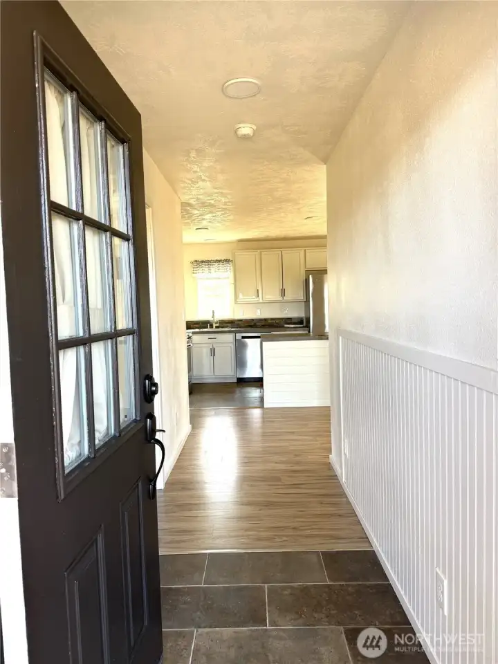 Entering into the home, Porcelain tile entry and laminate flooring throughout home.
