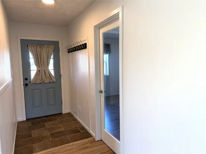 Look from inside entry, glass door leads to a bonus room.
