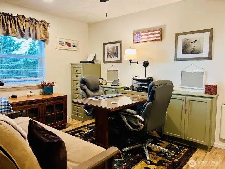 Another view of the office with furniture to show its size and window light.