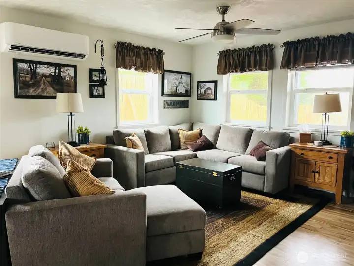 Another view of the living room with plenty of windows for lots of light.