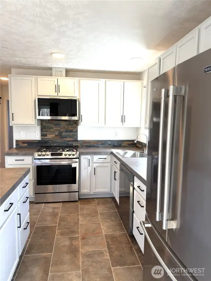 Porcelain tile is in the kitchen.