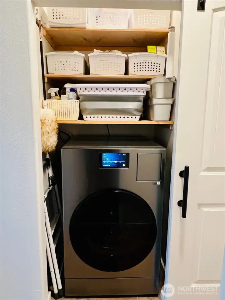 Laundry closet all in one ventless Washer/Dryer. Storage above.