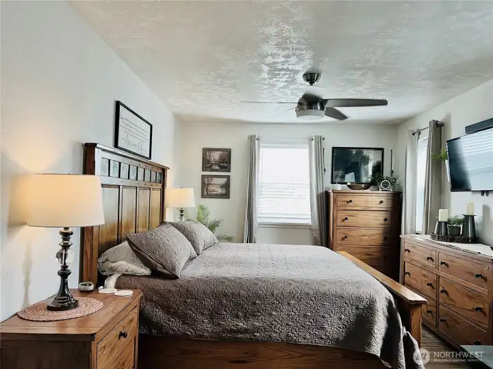 Primary bedroom large enough for a King-sized bed and large furniture.