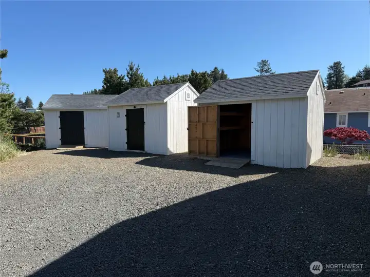 Outside are three 10' x 12' sheds with shelving and power.