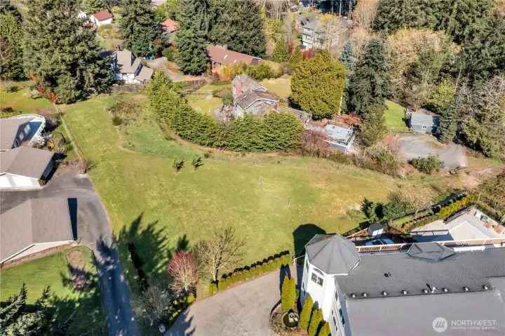 The lot has a slight slope. As far as we know, all homes to be built will have Sound and Mountain views.