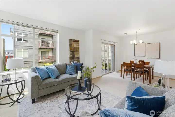 Open flow from the living room to the dining area and out to the deck