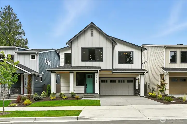 Plan 2552 Elevation A. Photo of home built on another lot. Details will vary