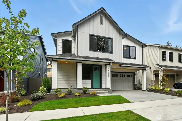 Plan 2552 Elevation A. Photo of home built on another lot. Details will vary
