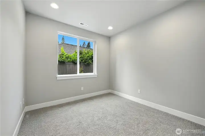 Main Floor Guest Room - Bedroom #1 - photos of same plan built on a different lot. Details will vary