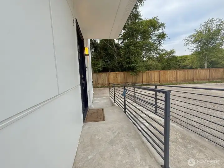 Zero-step accessible ramp to building.